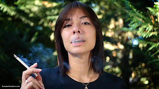 Sweet Russian Beauty Smoking Cigarette in Nature