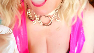 British Tart In Pink PVC Tina Snua Smoking A Cork 100 Cigarette With White Satin Gloves On