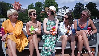 Eve Sweet and Delfine Dahlia Lead Naughty Amateurs in Outdoor Boat Party: Big Tits Bared