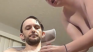 Employee Services Her Boss at His Desk