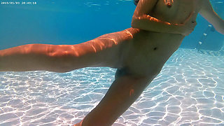 Ehibitionist nudist girl in public swimming