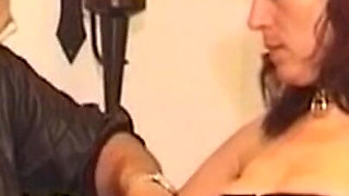 Mature Brunette Submits to Bondage with Two Men