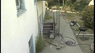 Two guys watch a slutty blond get fucked in her pussy by a machine