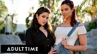 Jayden Cole and Victoria Voxxx kiss passionately on grey patterned sheets in the bright bedroom