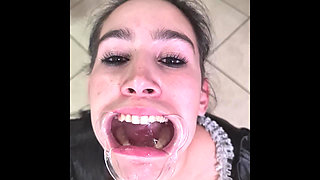 French Maid Tries to Swallow Her Own Piss Through Lip Retractor