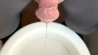 My small cock pissing, I'm wearing see through leggings and often allow my dick to poke out.