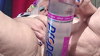 Big Bottle Plugged Clit Cunt