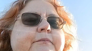 Bearded Lady try's to  lights  on windy beach!