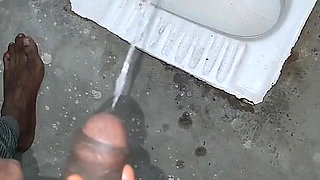 Desi Bhabhi Holding Stepbrother-in-law's Penis and Making Him Pee and Peeing Herself