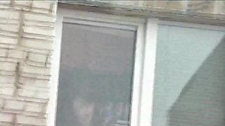 Naked in public. Random man taxi driver from car watches a naked woman washing apartment windows. Public nudity Naked woman  POV