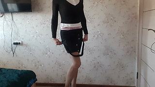 in a business suit, with a pink bodysuit underneath