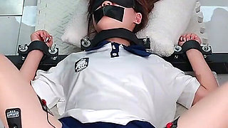 The Girl in a Metal Fixed Position, Legs Spread and Barefoot, Trembling to Climax