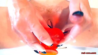 Redhead MILF Red XXX masturbates in a bubble bath