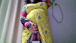 Crossdresser in a Yellow Maxi Gown