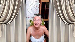 Hot housewife in the kitchen in home clothes.