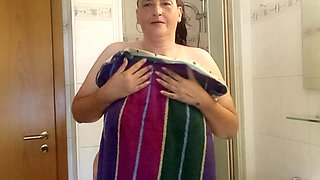 Mature German MILF 52 showers a chubby body under the shower