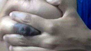 Squeezing Milk Out of Her Dark Nipples on Webcam