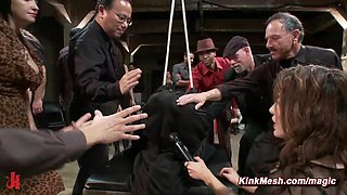 Tied and shrouded in a black sheet