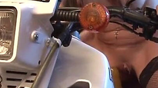 Skanky blonde rides motorcycle fucking machine