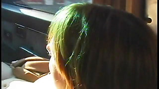 Commuter redhead carpools with creep who debases her in car in city traffic