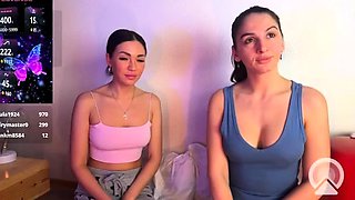 In a kitchen a sexy brunette playing with her big boobs