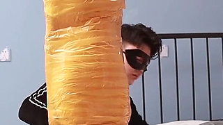 A Cute Barefoot Girlfriend Uses Tape to Bind Her Whole Body, Playing with Her Cute Bare Feet