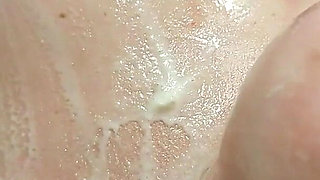 A Naked Woman with Huge Tits in a Massage Parlor Using Whipped Cream.
