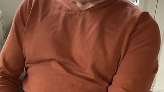 Jerking off and cumming in my orange sweater