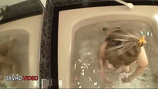 Hairy pussy Saki Oshiro seduces in Japanese bath hardcore then rides dick POV