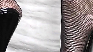 Goddess of High Heels Shows off Her Black Patent Leather Mules