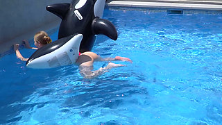 Lesbian Girls Are Having Fun in a Pool with an Inflatable Shark