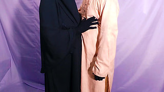 Bangladeshi beautiful hijabi woman enjoying with her neighbor in her bedroom