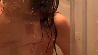 Red-haired Beauty Entertains Herself with Fingers and a Toy Friend in the Shower
