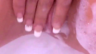 Hot blonde Daniella Margot fucks herself with a finger in the bath